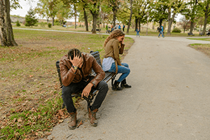 Image of couple on park bench facing away from eachother